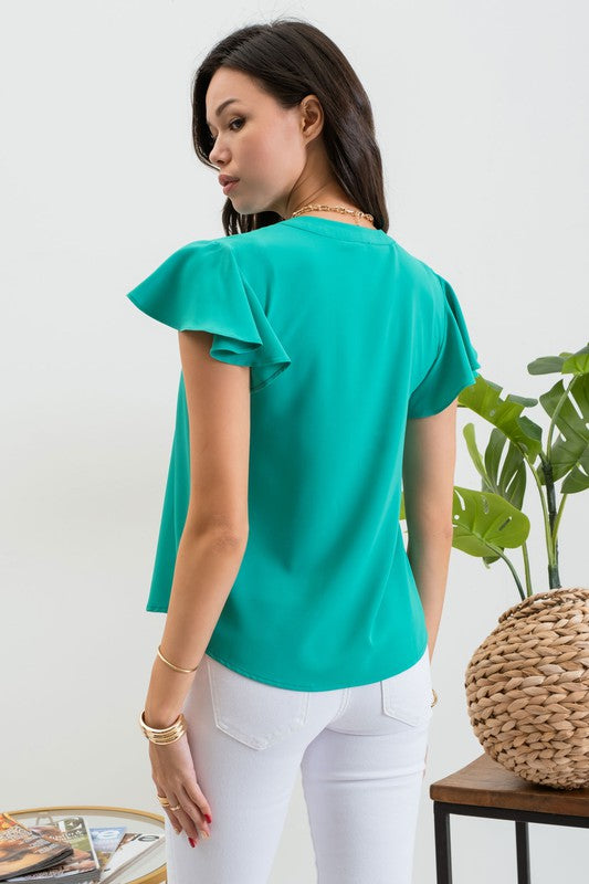 SOLID FLUTTER SLEEVE WOVEN TOP