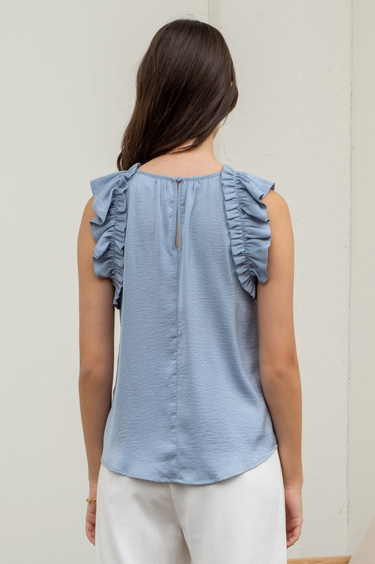 SLEEVELESS RUFFLE TRIM BLOUSE