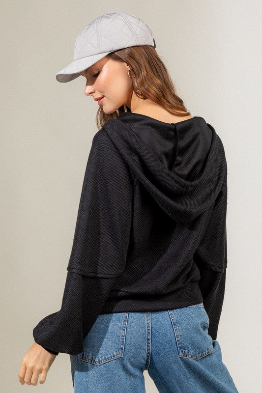 Raglan sleeve hooded knit top